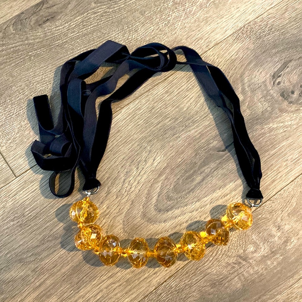 Cute necklace with black velvet ties.